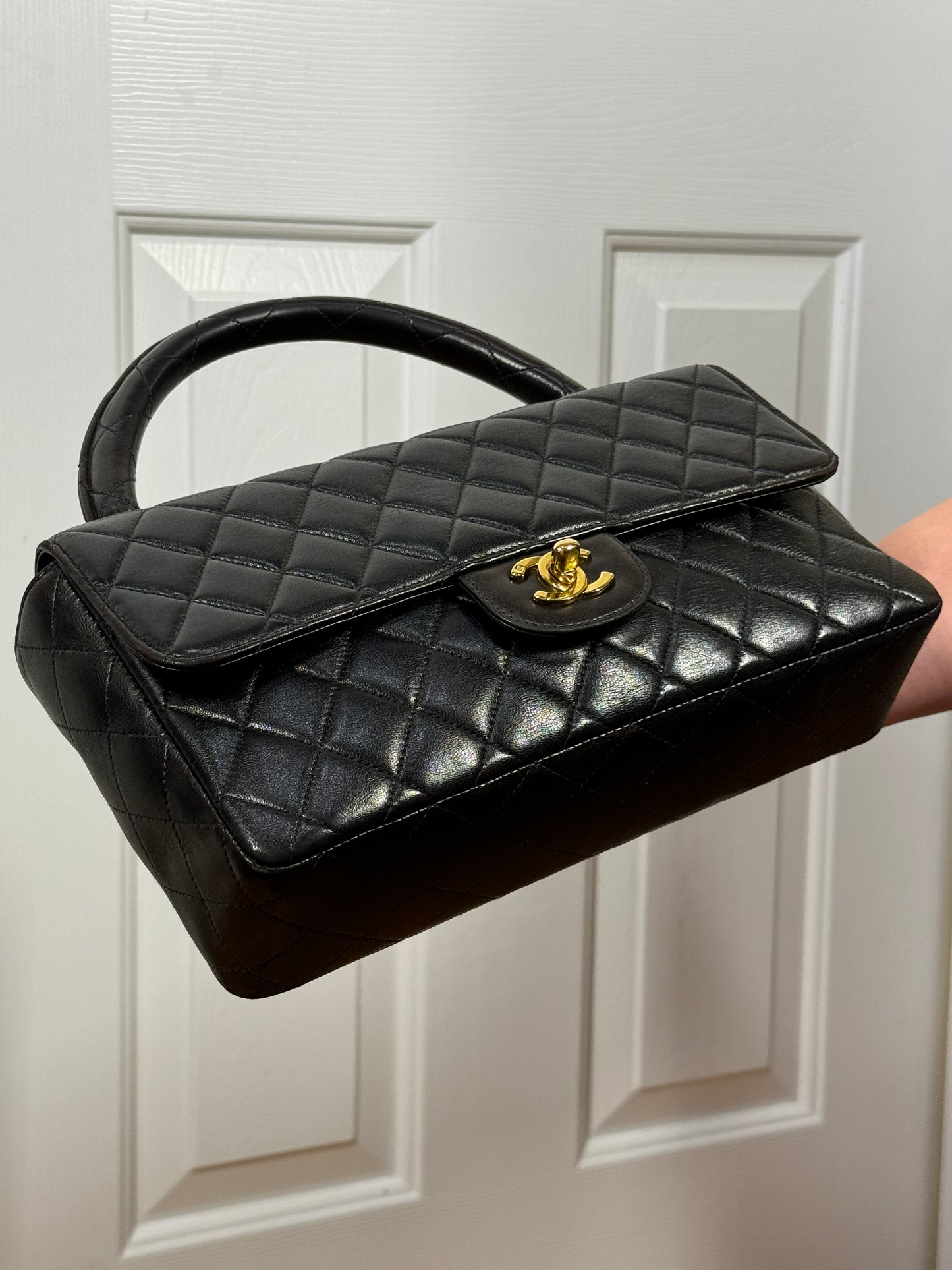 Chanel Vintage 90s Black Quilted Lambskin Medium Kelly Top Handle Parent Flap Bag w 24K Gold Plated Hardware